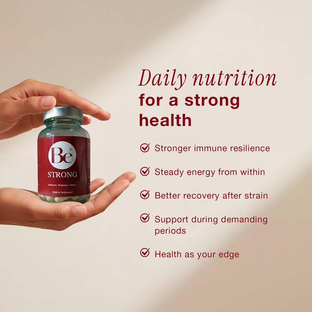 Be Strong supplement bottle with turmeric, berries, and ginger on a red background