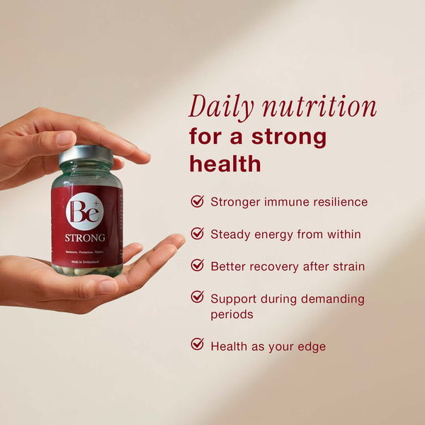 Be Strong supplement bottle held in hands with daily nutrition benefits for immune resilience and energy